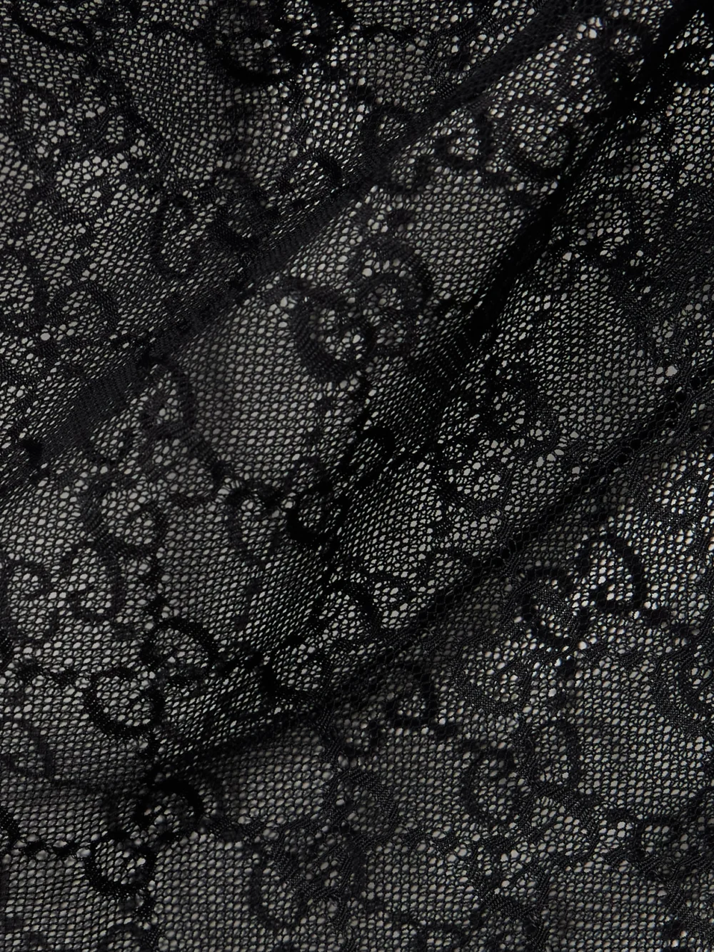 Close-up detail of the Gucci Gg Stretch-lace Top
