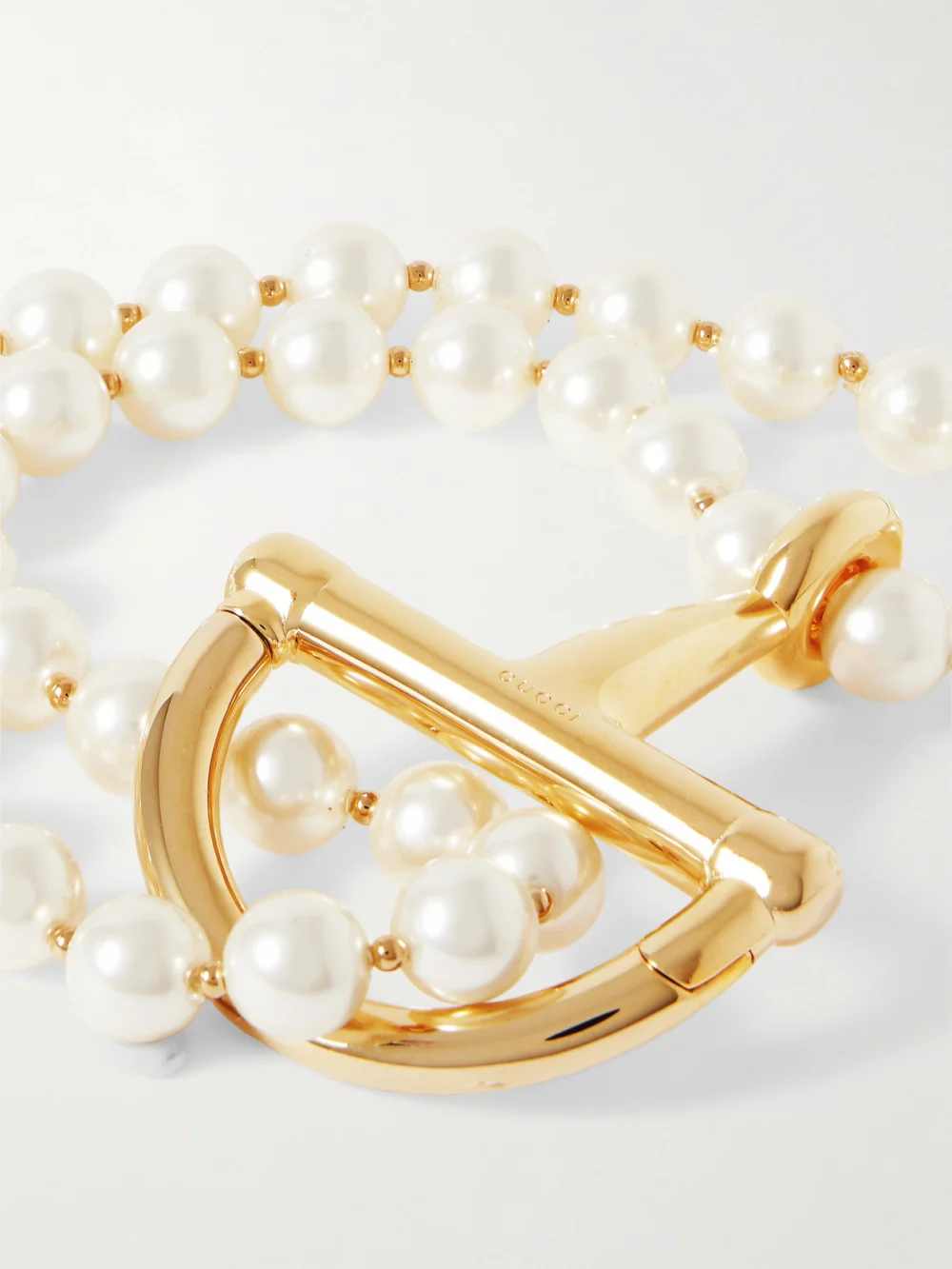 Close-up detail of the Gucci Gold-tone and Faux Pearl Bracelet