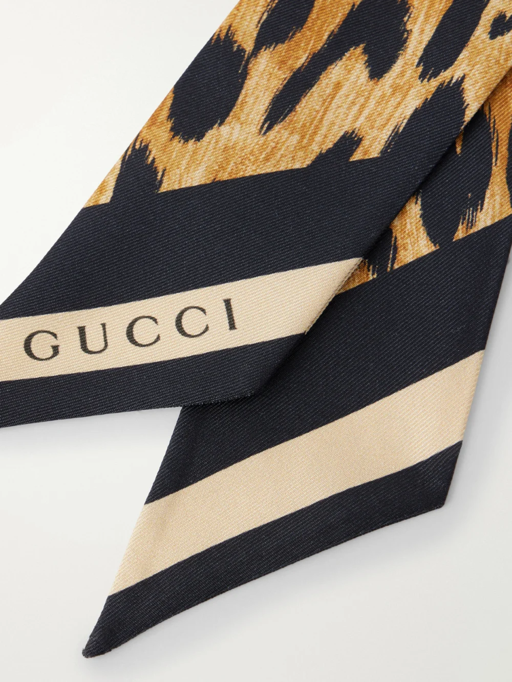 Close-up detail of the Gucci Heritage Animal-print Silk Twill Scarf