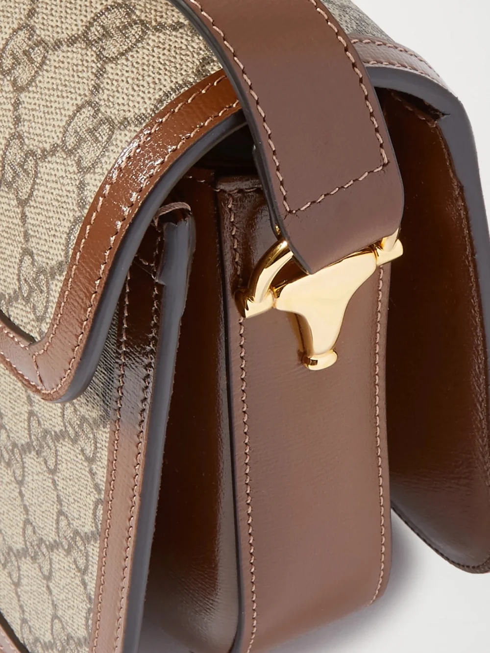 Close-up detail of the Gucci Horsebit 1955 Leather-trimmed Coated Canvas-jacquard Shoulder Bag