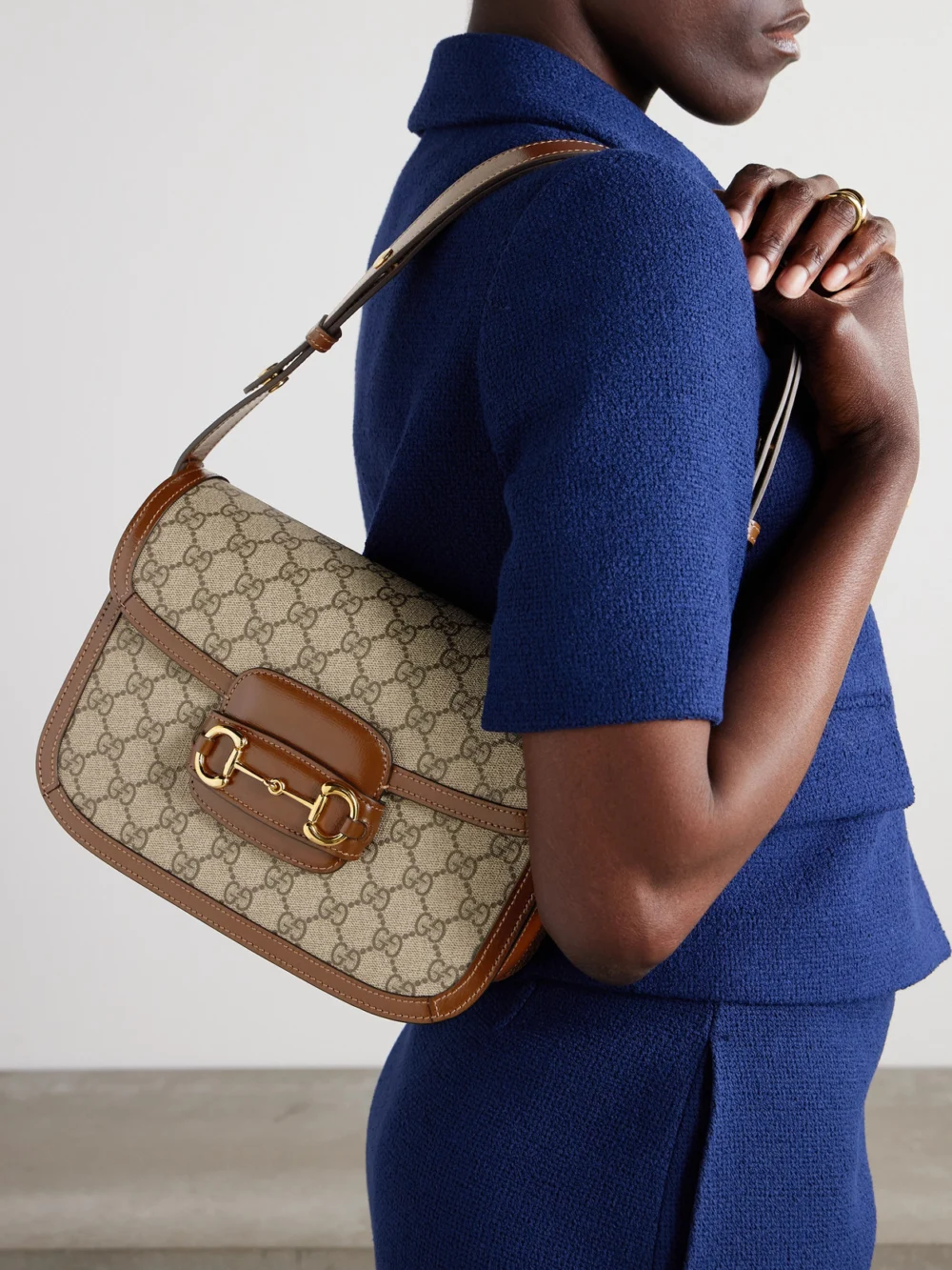 Gucci Horsebit 1955 Leather-trimmed Coated Canvas-jacquard Shoulder Bag, styled view