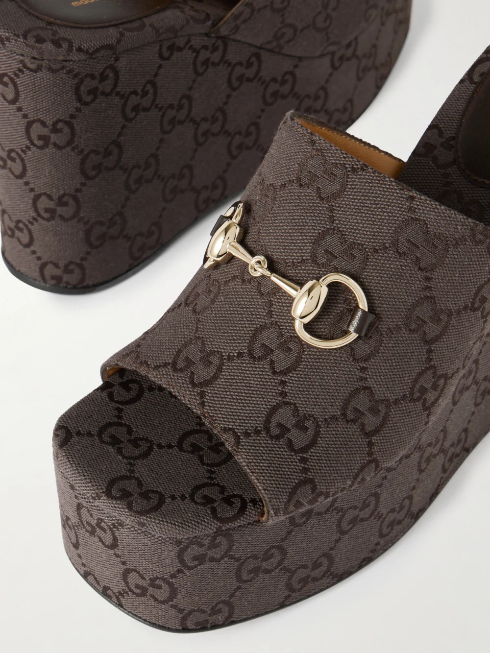 Close-up detail of the Gucci Horsebit-embellished Canvas-jacquard Platform Mules