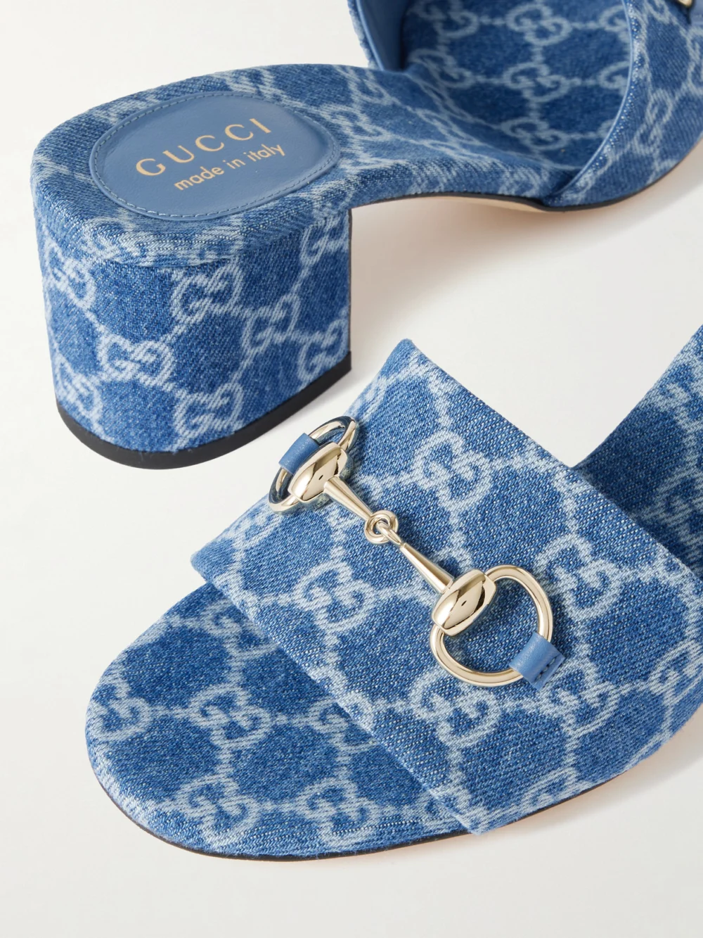 Close-up detail of the Gucci Horsebit-embellished Logo-print Denim Mules