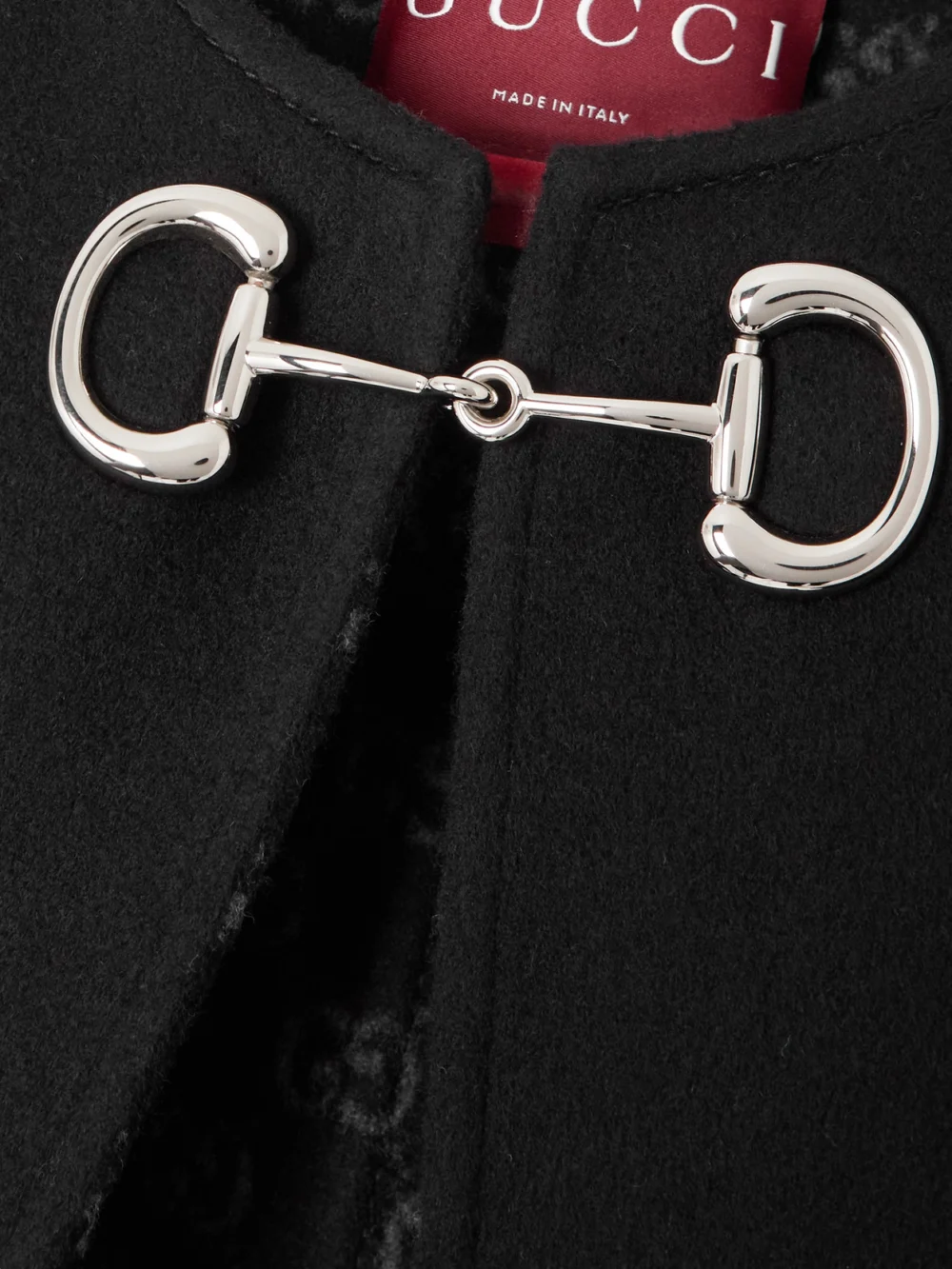 Close-up detail of the Gucci Horsebit-embellished Wool and Silk-blend Cape