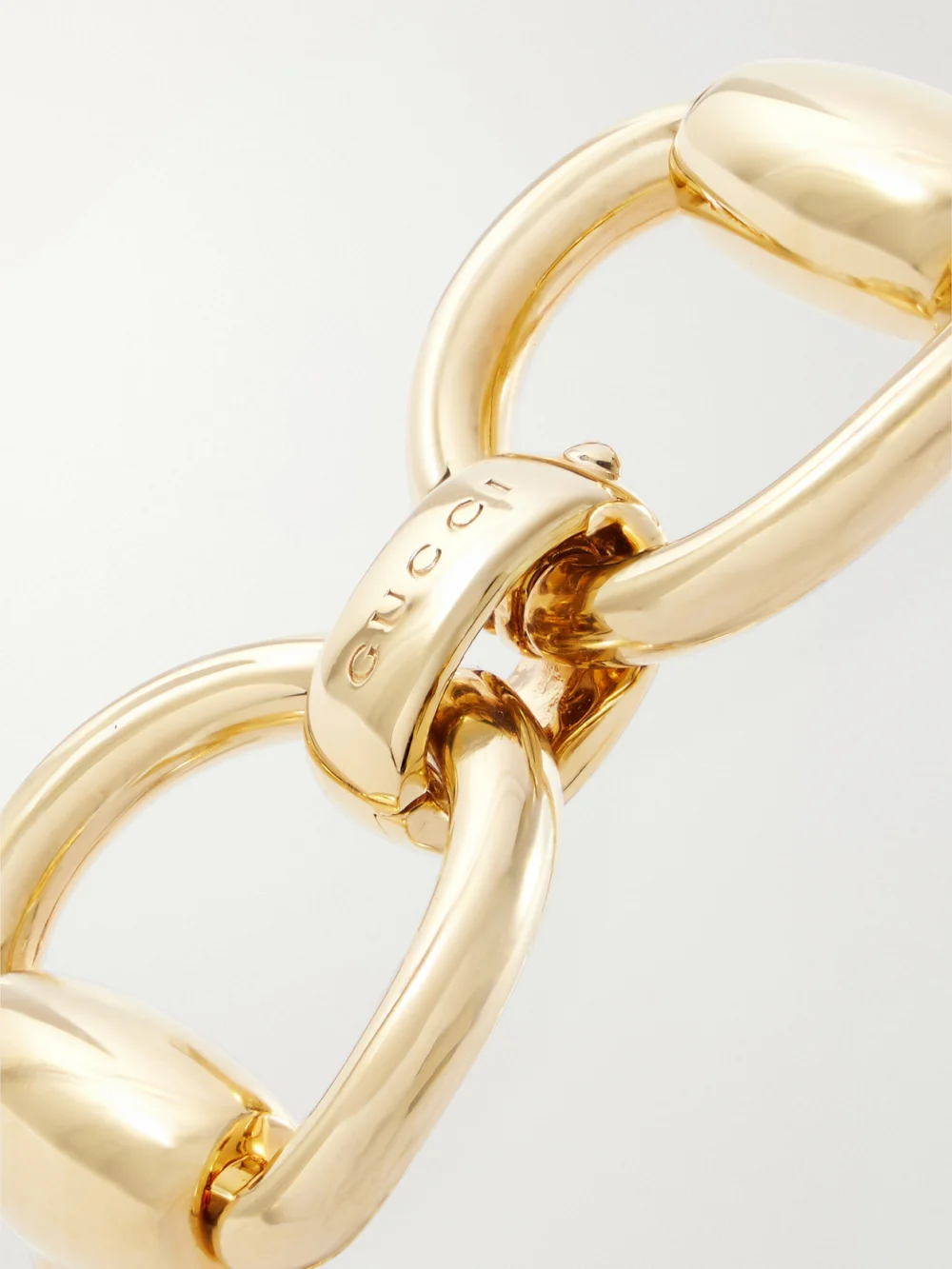Close-up detail of the Gucci Horsebit Gold-tone Bangle