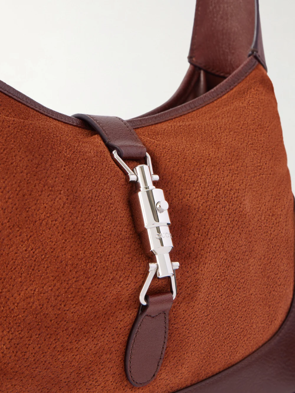 Close-up detail of the Gucci Jackie 1961 Leather-trimmed Suede Shoulder Bag