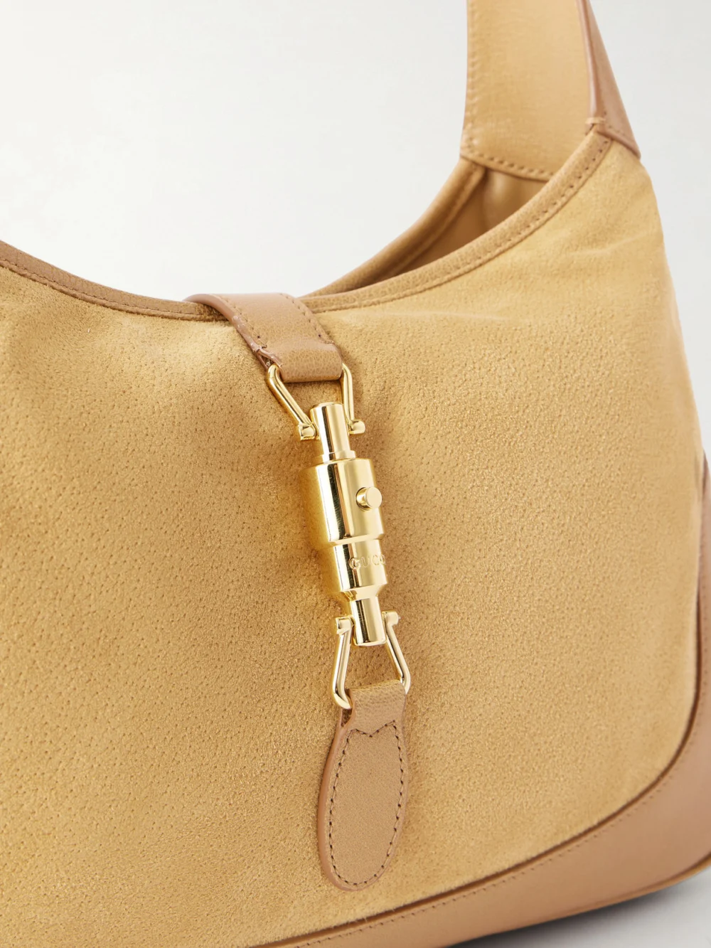 Close-up detail of the Gucci Jackie 1961 Leather-trimmed Suede Shoulder Bag