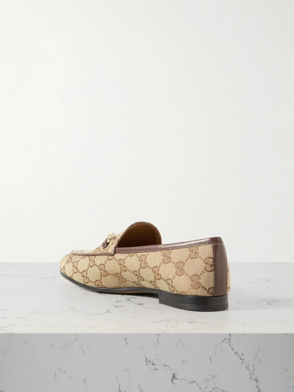 Back view of the Gucci Jordaan Horsebit-detailed Leather-trimmed Canvas-jacquard Loafers