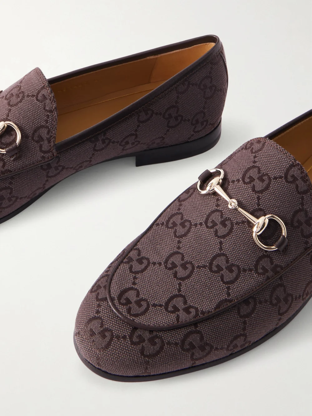Close-up detail of the Gucci Jordaan Horsebit-detailed Leather-trimmed Canvas-jacquard Loafers