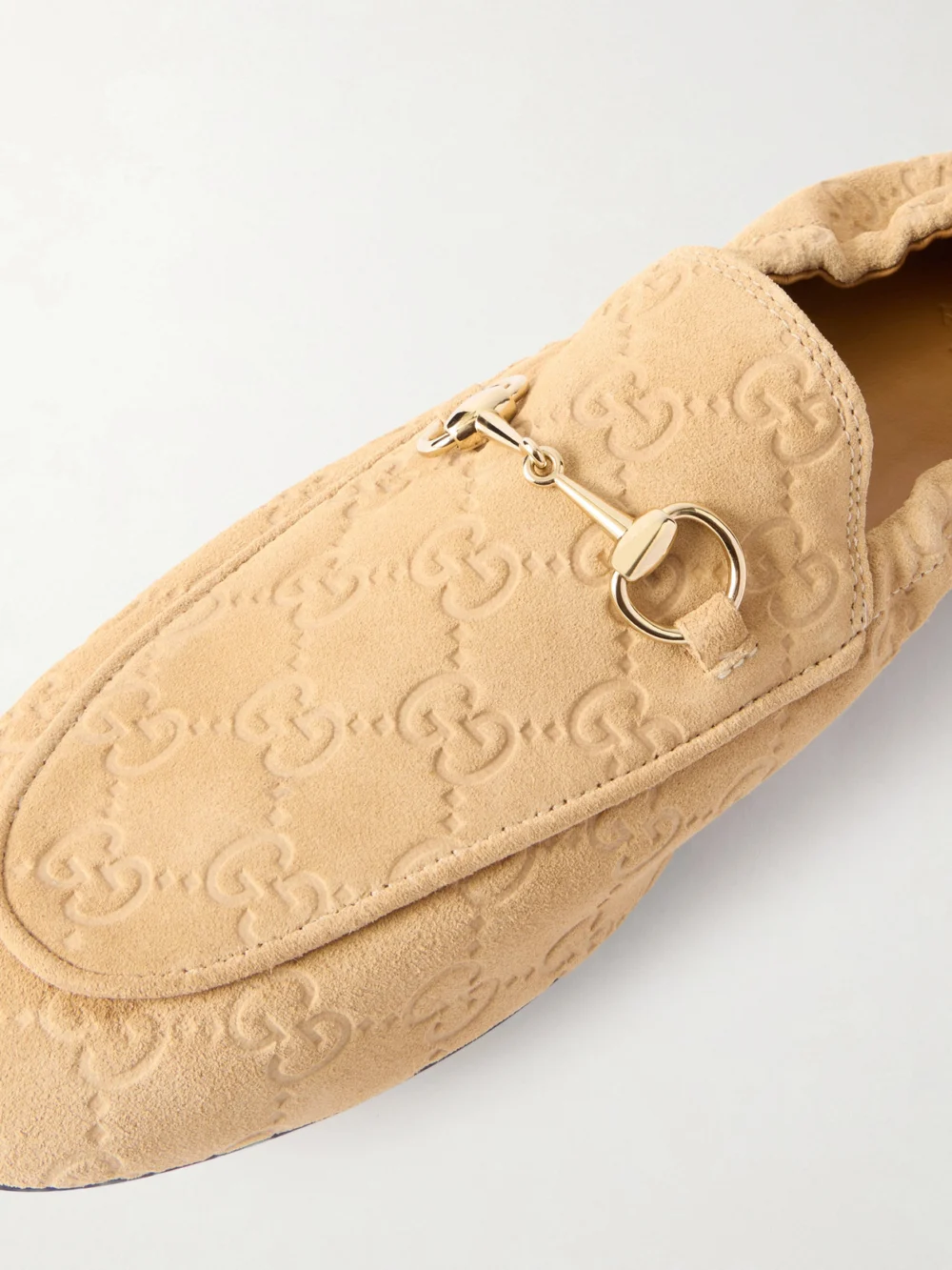 Close-up detail of the Gucci Jordaan Horsebit-embellished Logo-debossed Suede Loafers