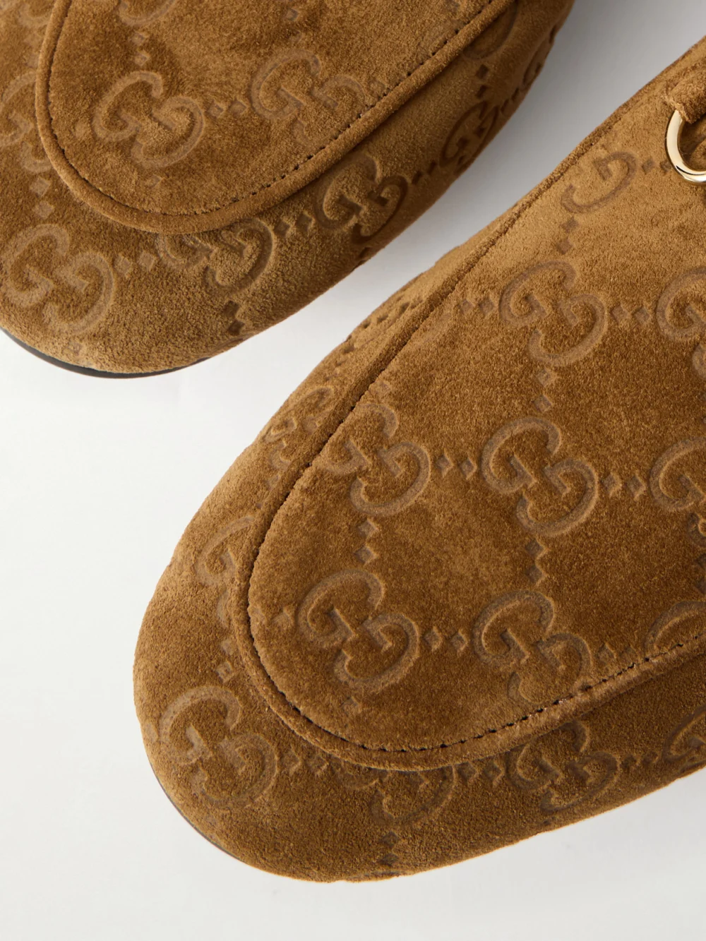 Close-up detail of the Gucci Jordaan Horsebit-embellished Logo-debossed Suede Loafers