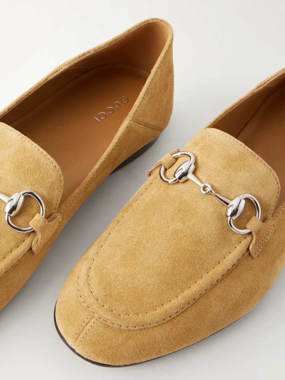 Close-up detail of the Gucci Jordaan Horsebit-embellished Suede Loafers