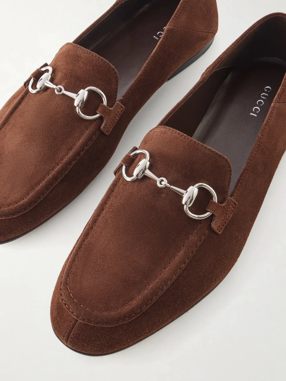 Close-up detail of the Gucci Jordaan Horsebit-embellished Suede Loafers