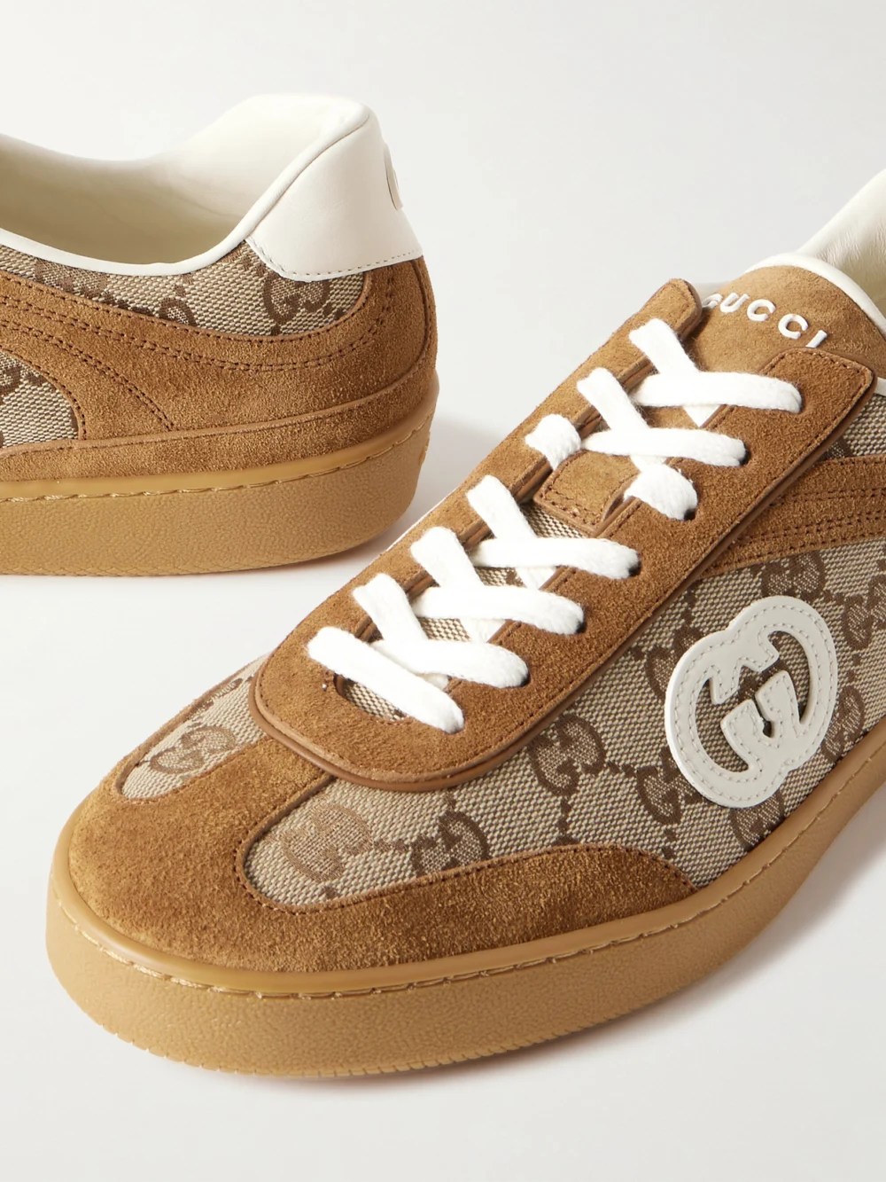 Close-up detail of the Gucci Leather and Suede-trimmed Coated Canvas-jacquard Sneakers