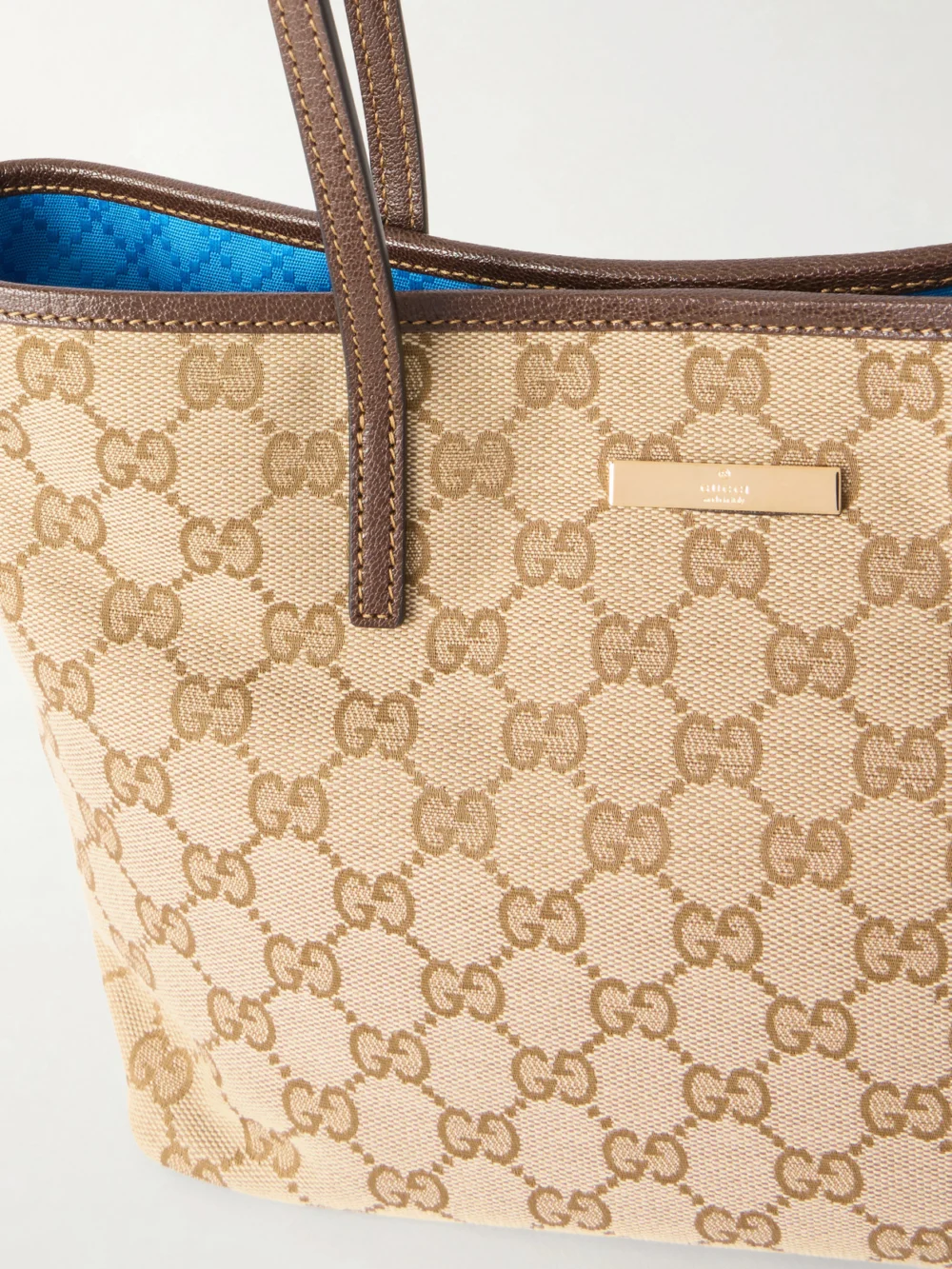Close-up detail of the Gucci Leather-trimmed Coated Canvas-jacquard Tote