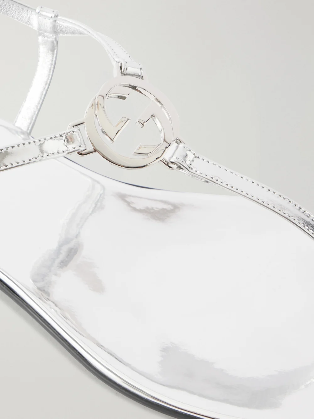Close-up detail of the Gucci Logo-embellished Leather Thong Sandals