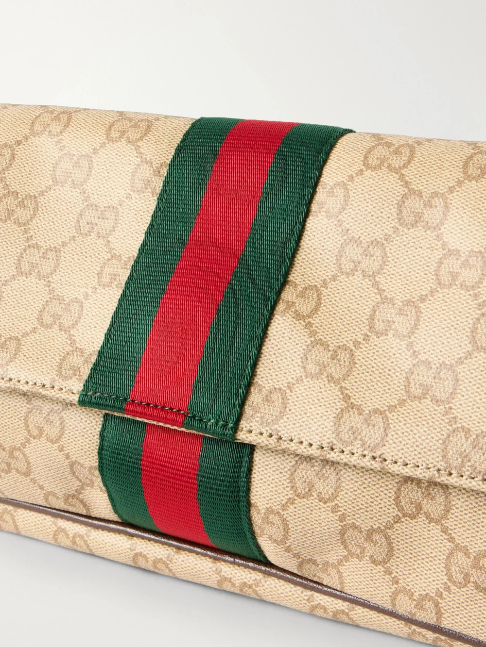 Close-up detail of the Gucci Madison Leather-trimmed Coated Canvas-jacquard Shoulder Bag