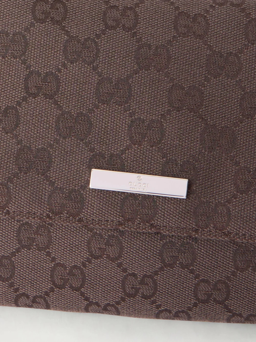Close-up detail of the Gucci Madison Leather-trimmed Coated Canvas-jacquard Shoulder Bag