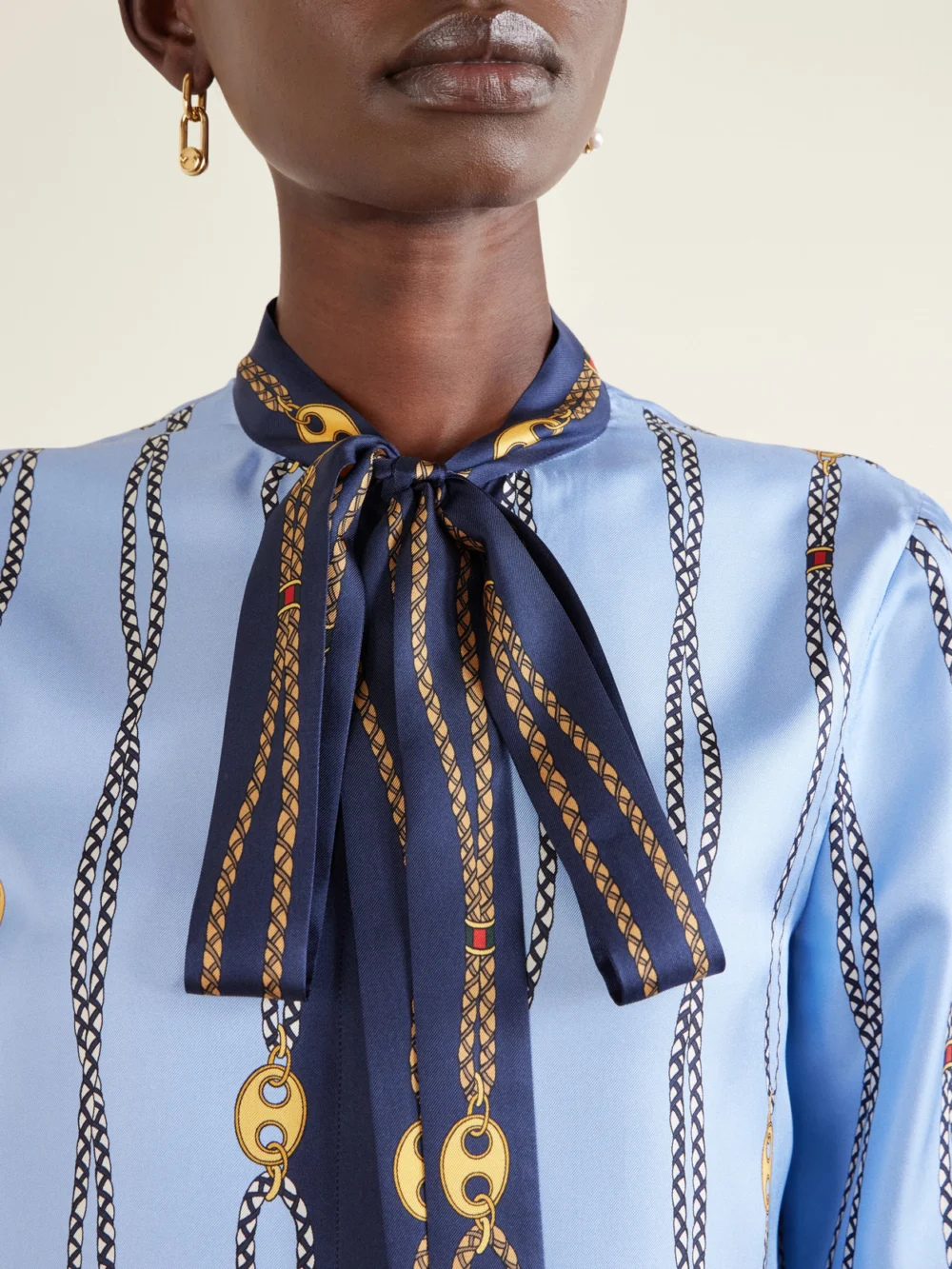 Close-up detail of the Gucci Marina Waves Pussy-bow Printed Silk-twill Shirt