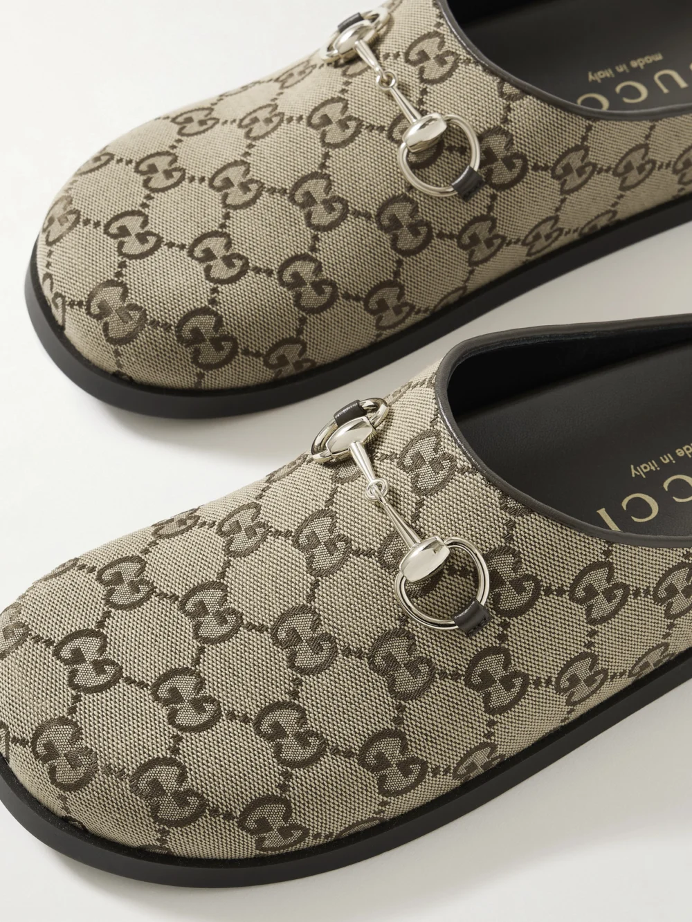 Close-up detail of the Gucci New Sol Horsebit-detailed Leather-trimmed Canvas-jacquard Slippers