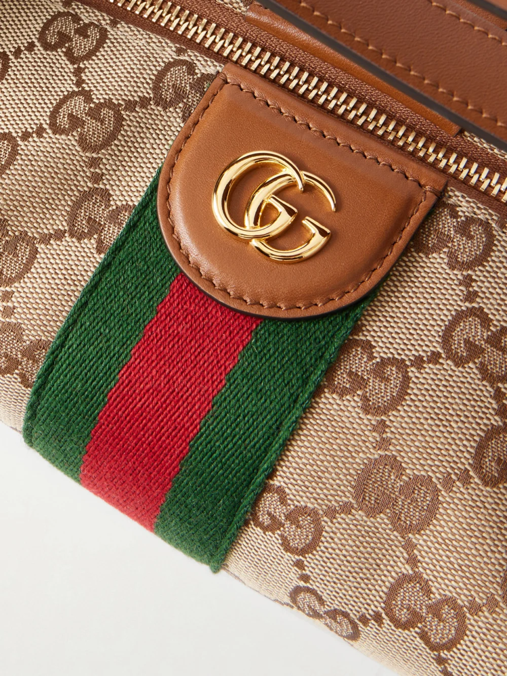 Close-up detail of the Gucci Ophidia Leather-trimmed Coated Canvas-jacquard Clutch