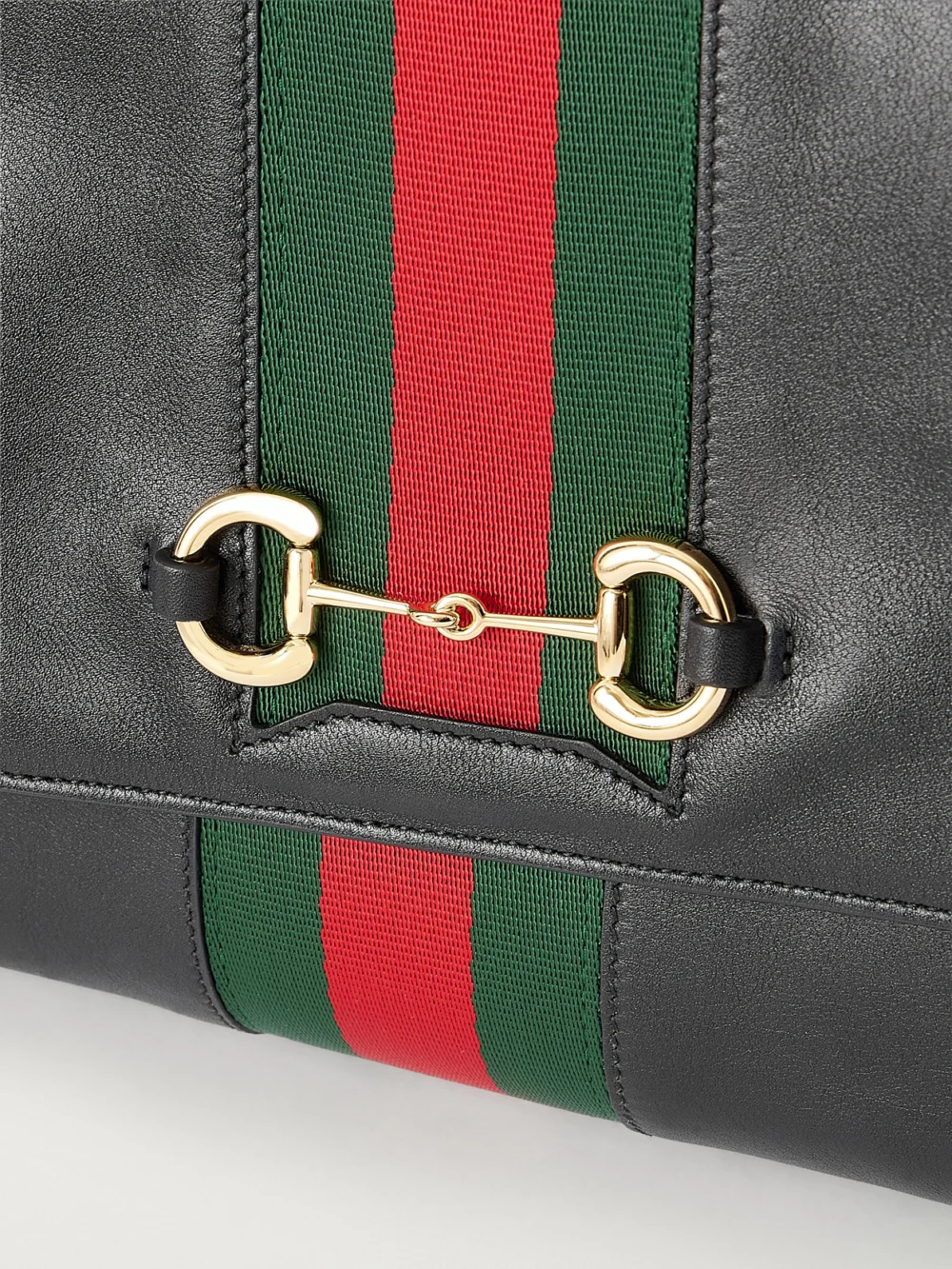 Close-up detail of the Gucci Paparazzo Medium Leather Shoulder Bag