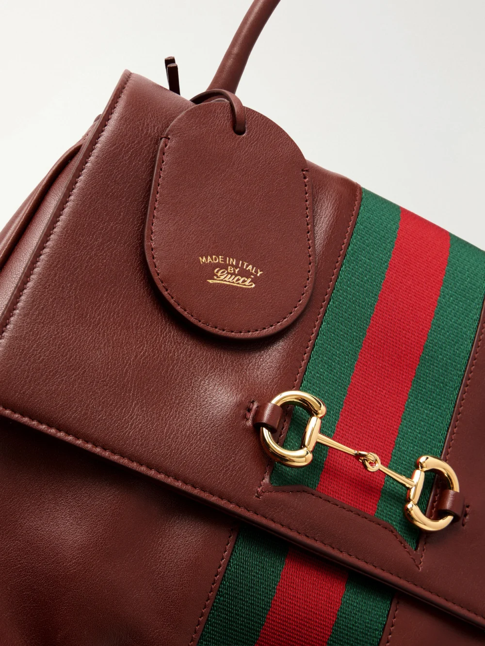 Close-up detail of the Gucci Paparazzo Medium Leather Shoulder Bag