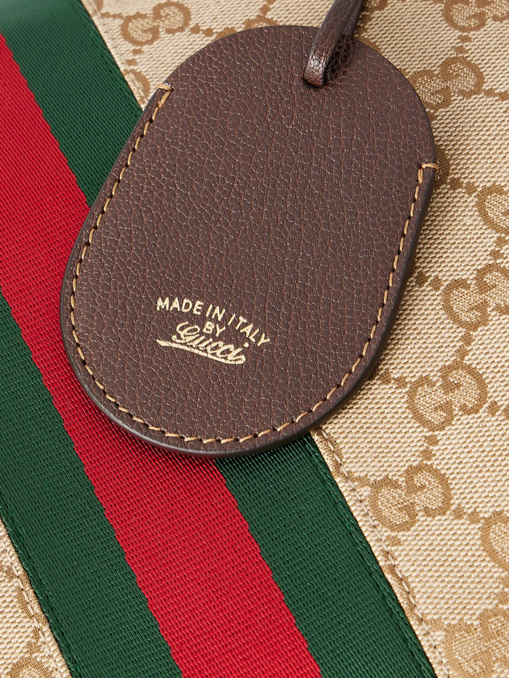 Close-up detail of the Gucci Paparazzo Medium Leather-trimmed Canvas-jacquard Shoulder Bag