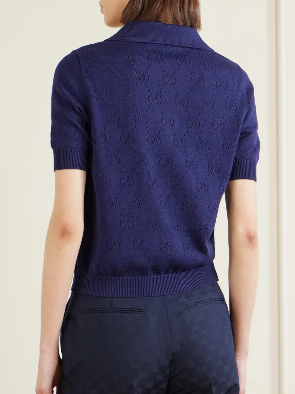Back view of the Gucci Perforated Silk and Cotton-blend Polo Top