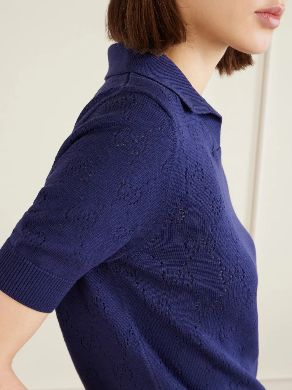 Close-up detail of the Gucci Perforated Silk and Cotton-blend Polo Top