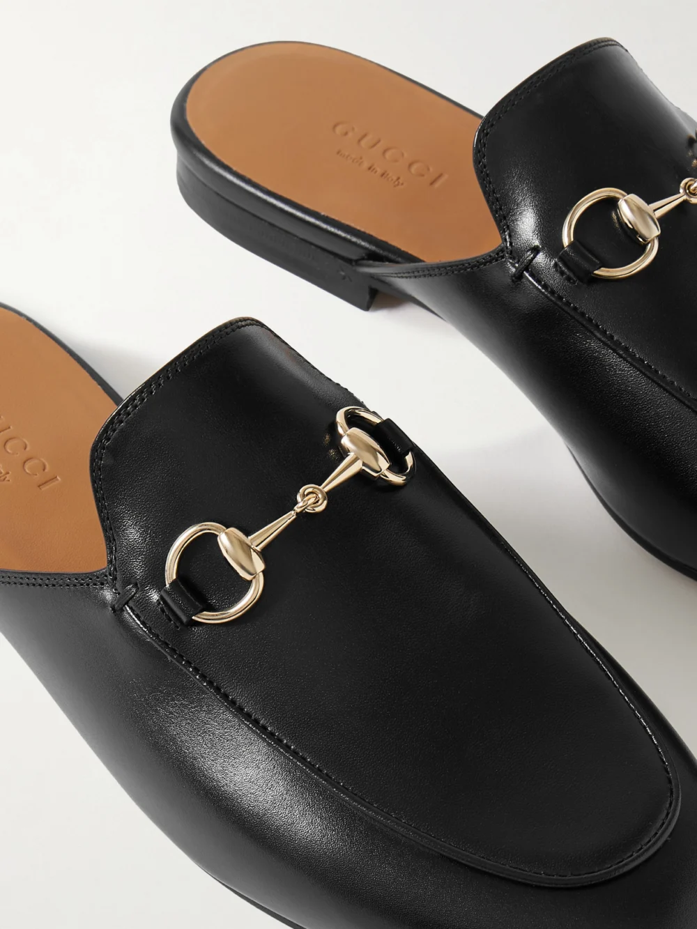 Close-up detail of the Gucci Princetown Horsebit-detailed Leather Slippers