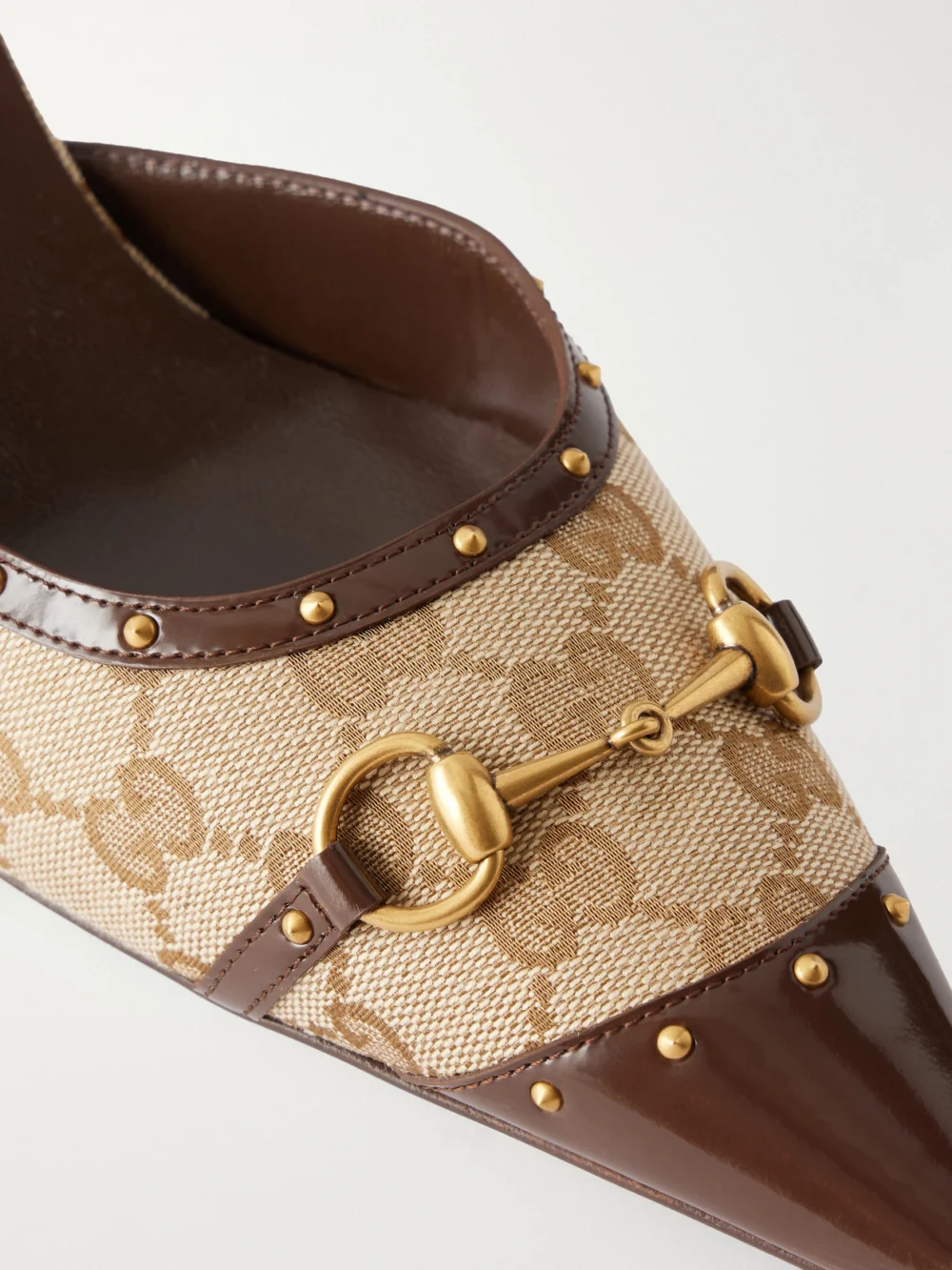 Close-up detail of the Gucci Savoy Horsebit-embellished Leather-trimmed Canvas-jacquard Pumps