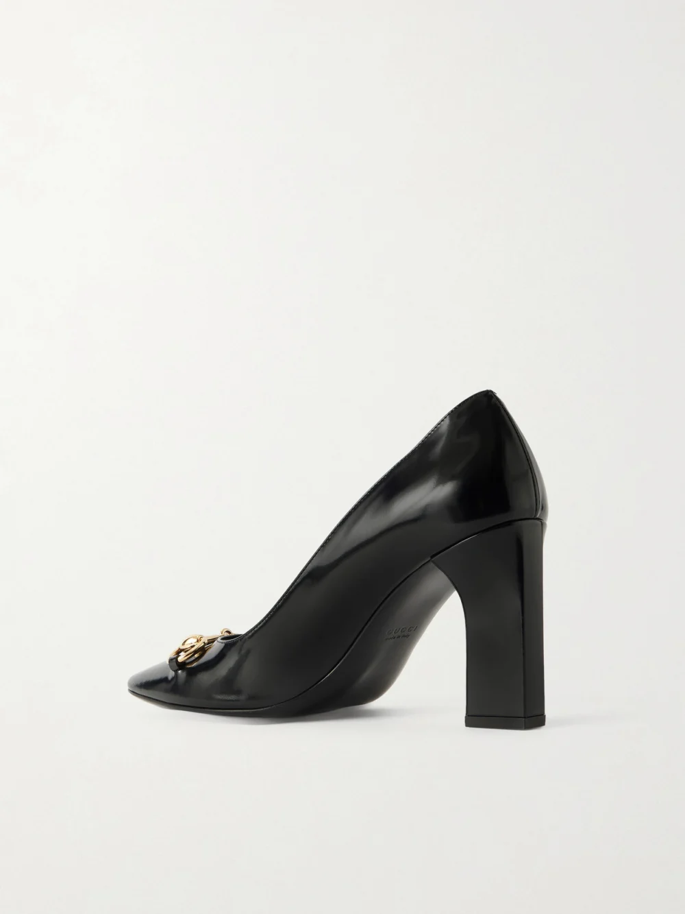 Back view of the Gucci Signora 85 Horsebit-embellished Glossed Leather Pumps