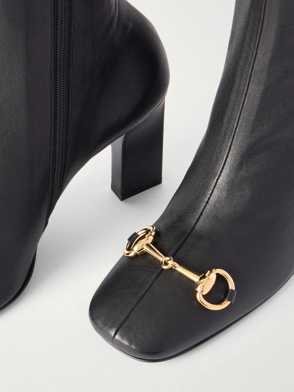 Close-up detail of the Gucci Signora Horsebit-embellished Leather Knee Boots