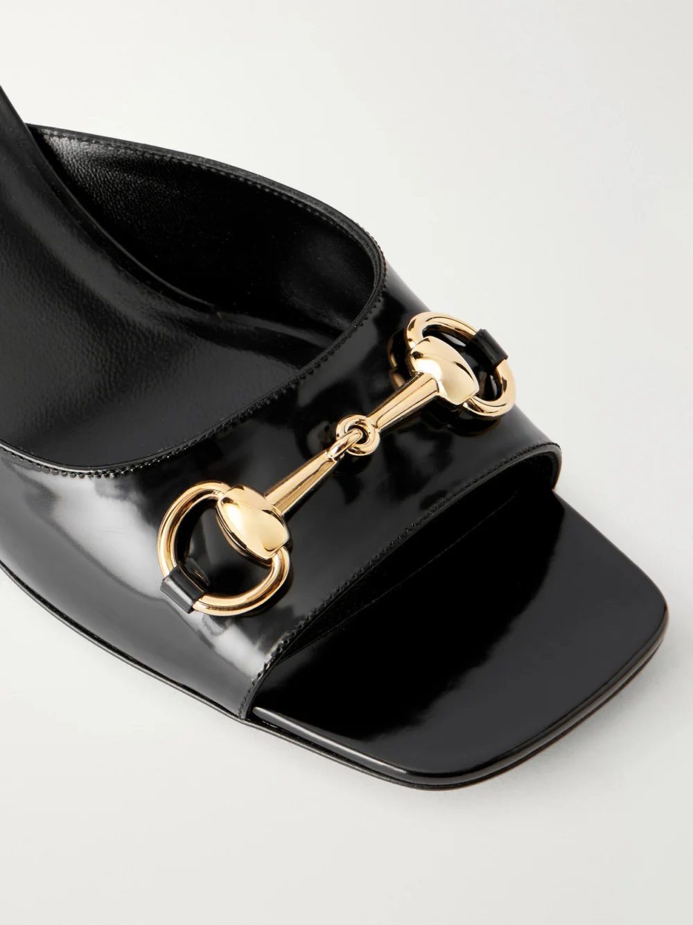 Close-up detail of the Gucci Signora Horsebit-embellished Leather Sandals