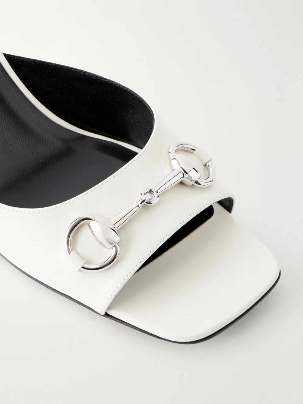 Close-up detail of the Gucci Signora Horsebit-embellished Leather Sandals