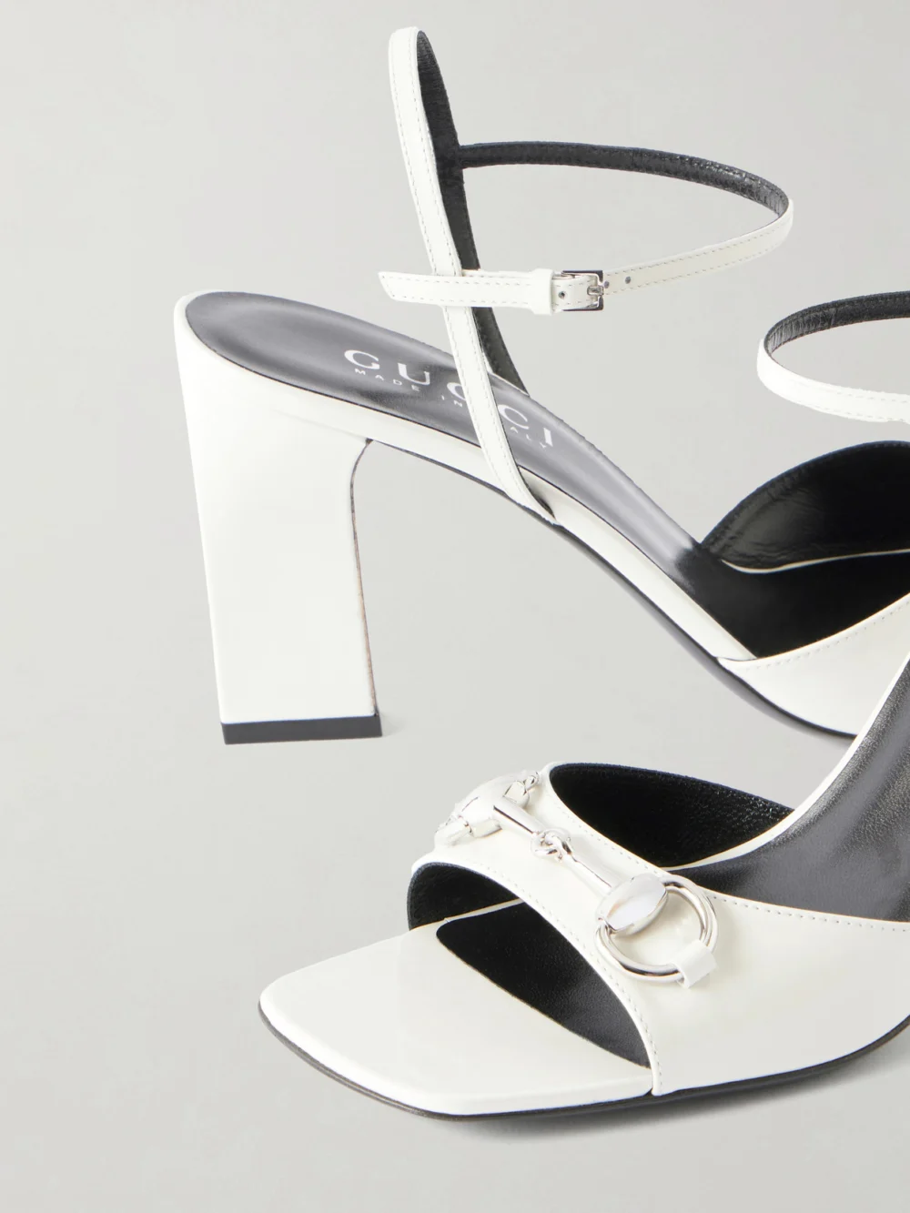Close-up detail of the Gucci Signora Horsebit-embellished Patent-leather Sandals