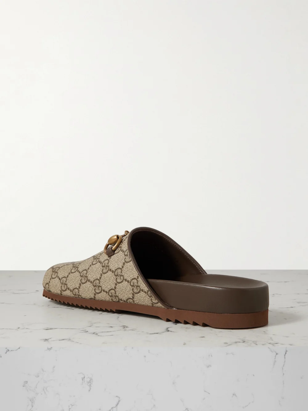 Back view of the Gucci Sol Embellished Leather-trimmed Canvas-jacquard Slippers