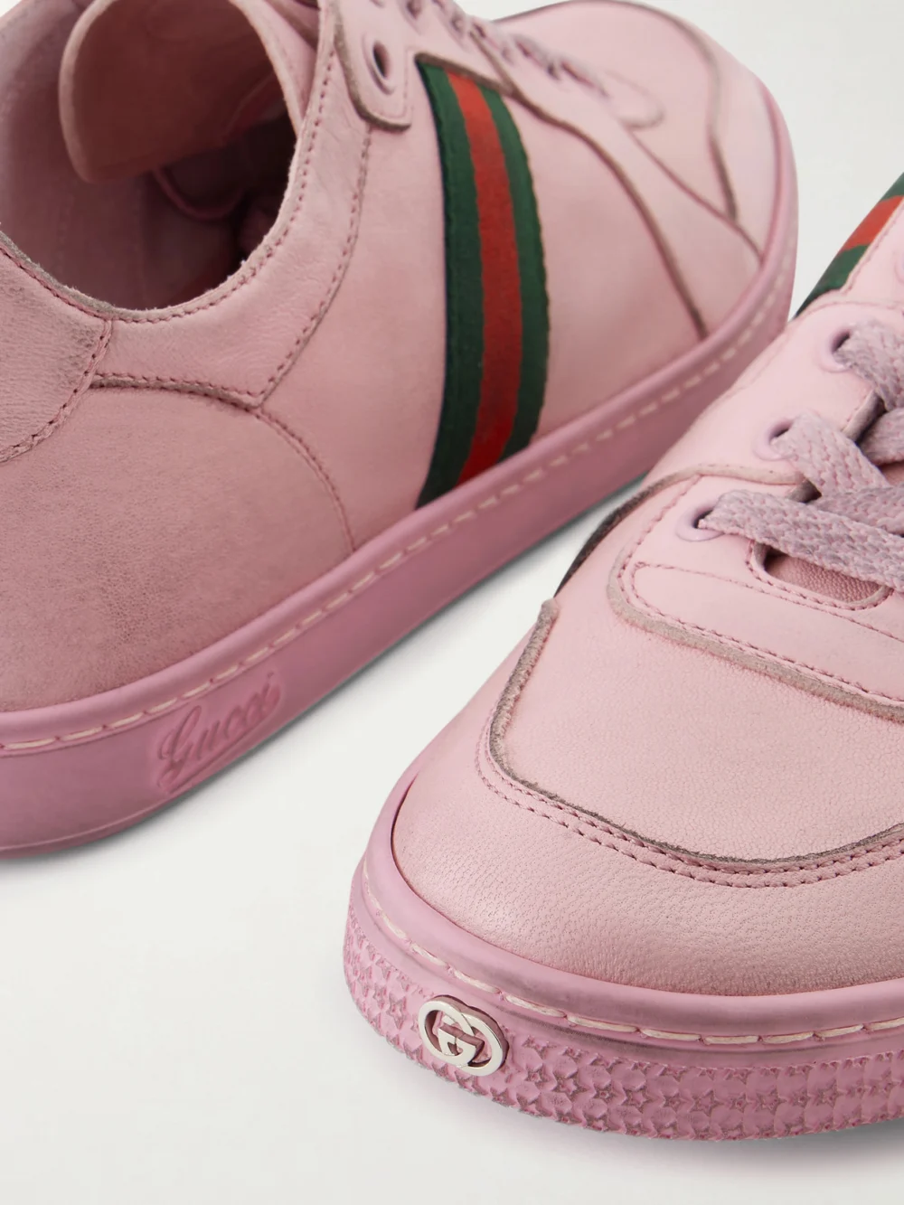 Close-up detail of the Gucci Stretch Distressed Webbing-trimmed Leather Sneakers