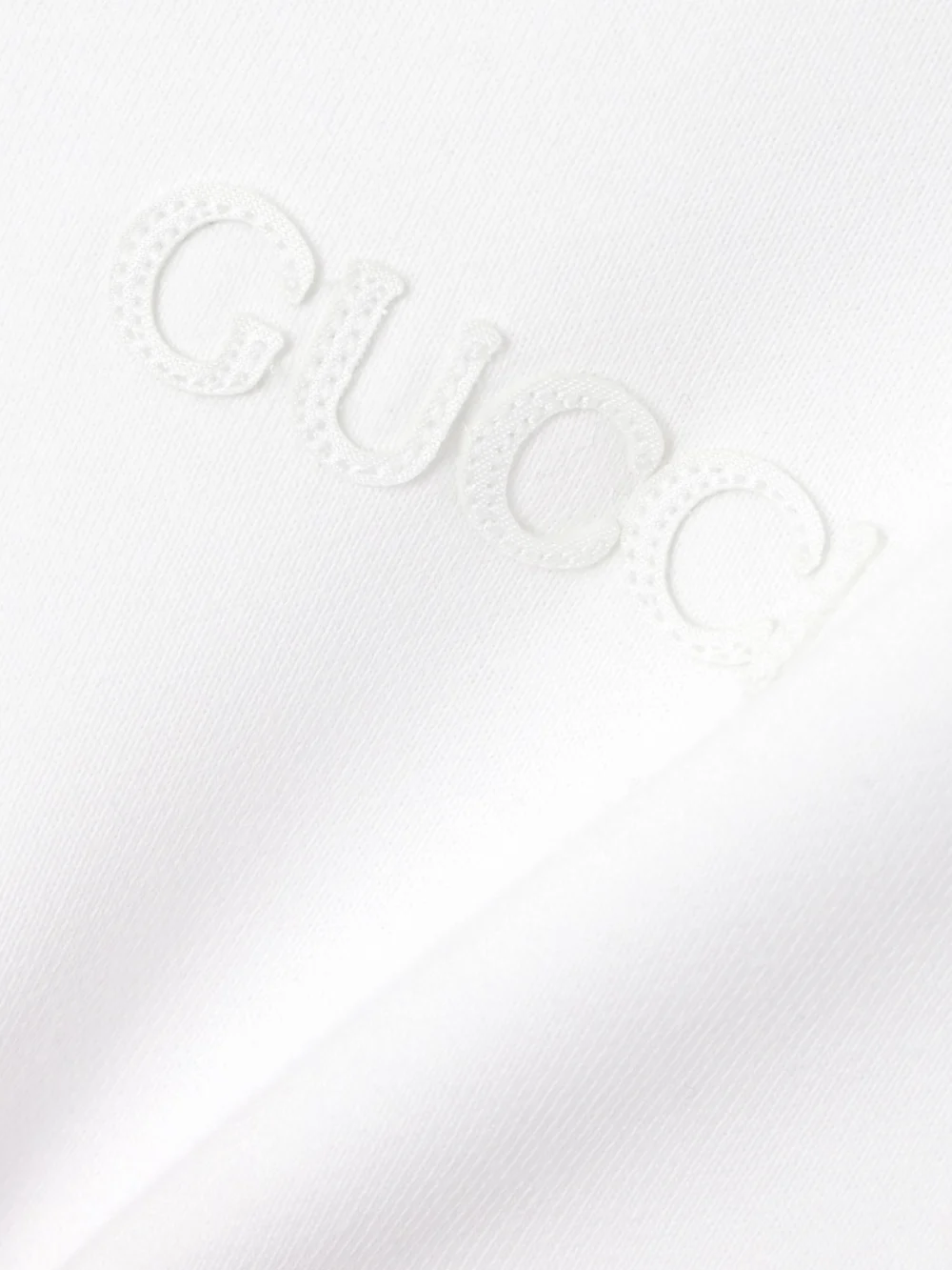 Close-up detail of the Gucci Striped Cotton-jersey T-shirt