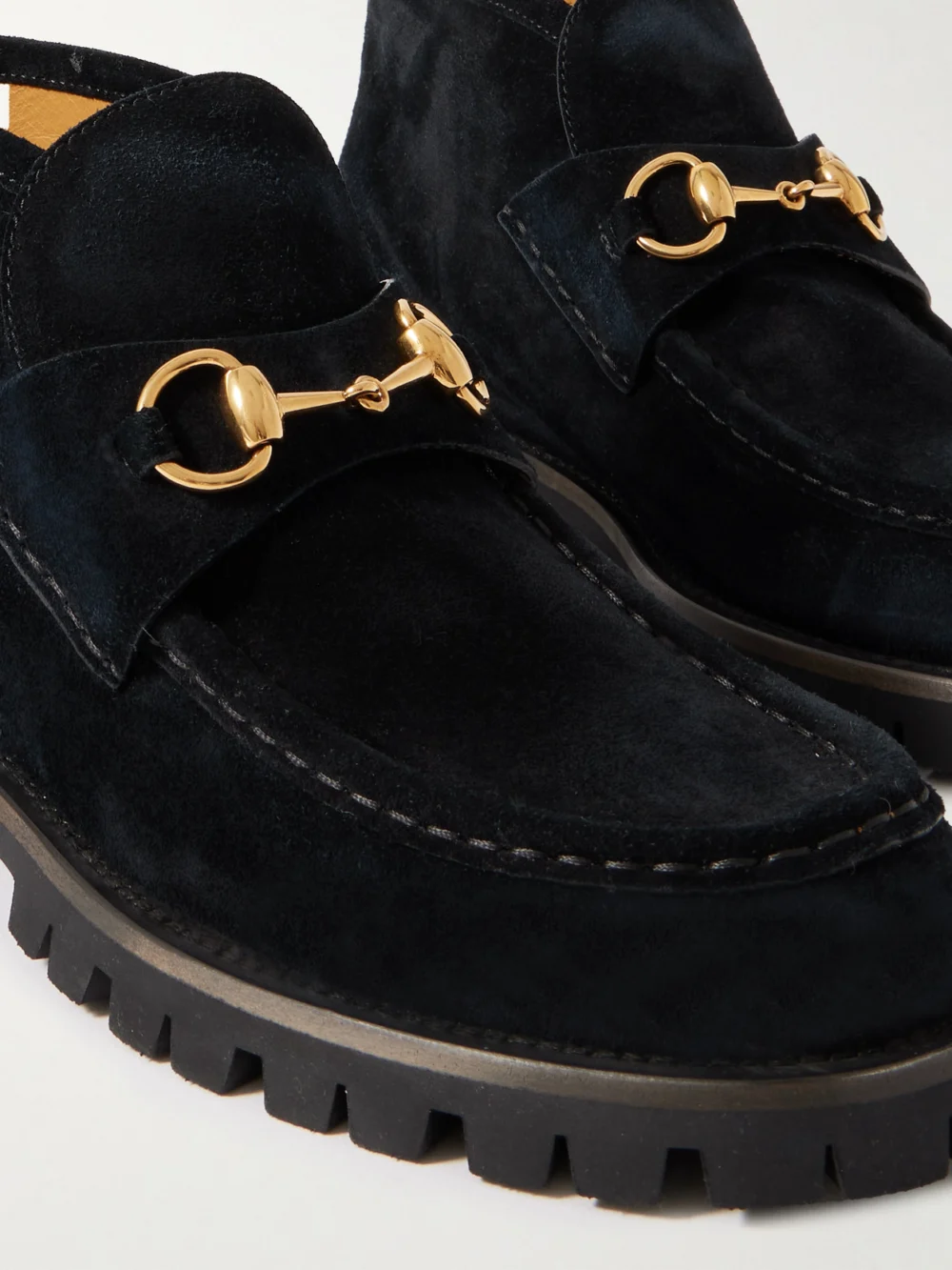 Close-up detail of the Gucci Sylke Horsebit-detailed Suede Ankle Boots