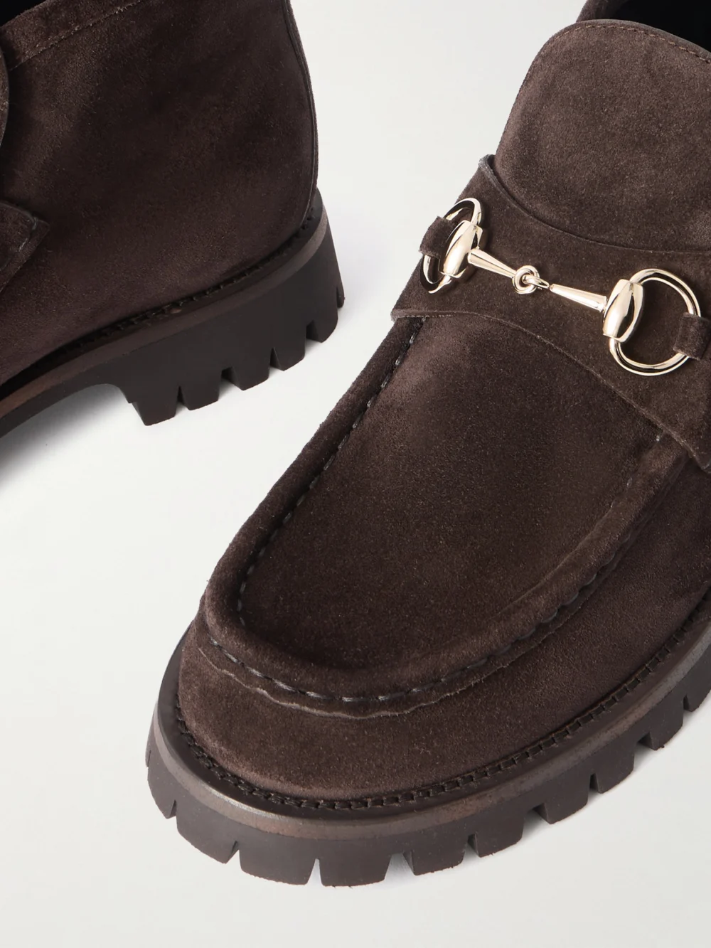 Close-up detail of the Gucci Sylke Horsebit-detailed Suede Ankle Boots