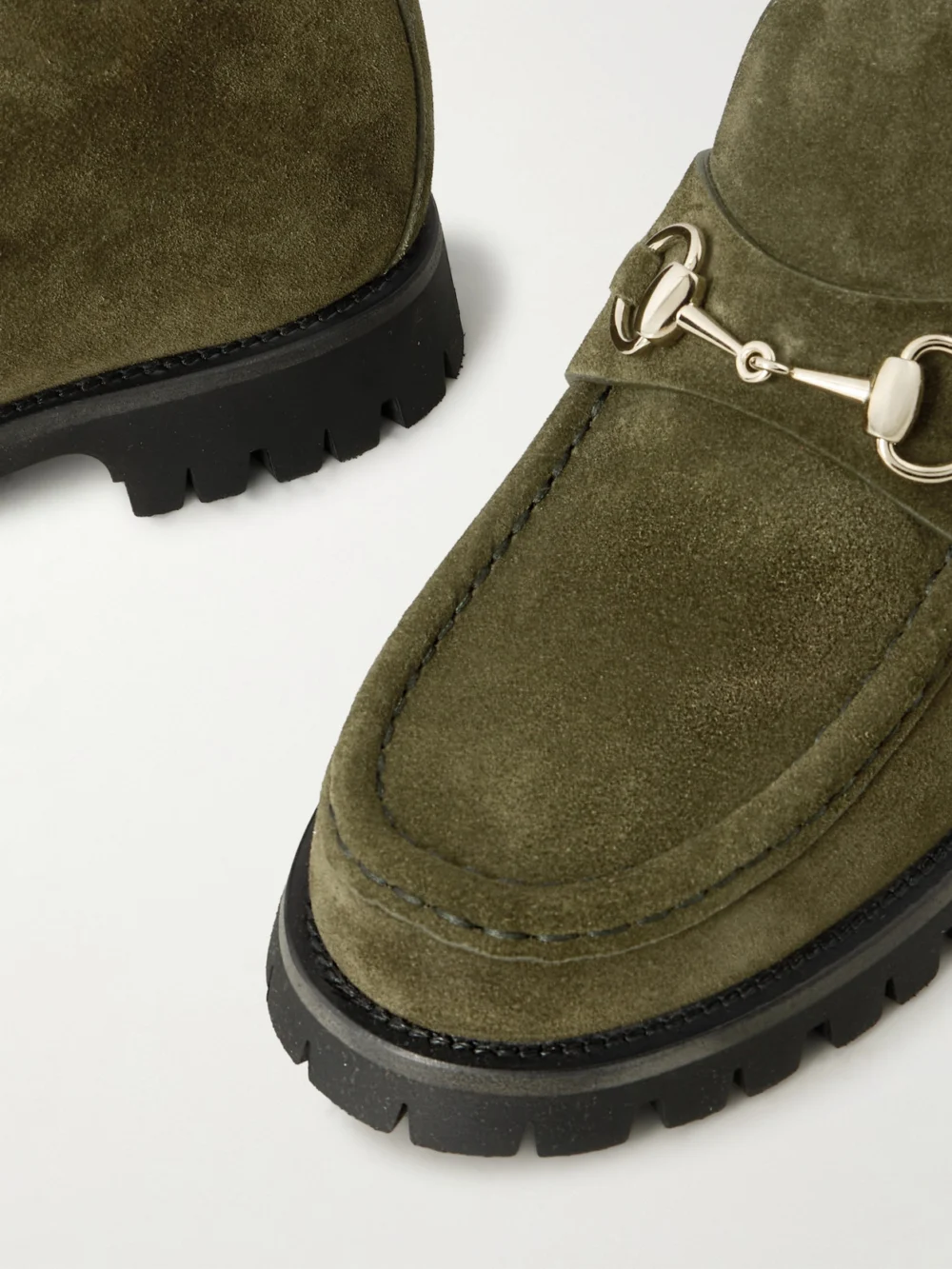 Close-up detail of the Gucci Sylke Horsebit-detailed Suede Ankle Boots