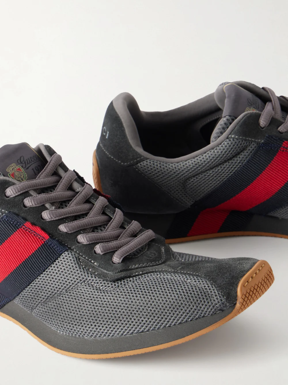 Close-up detail of the Gucci Tempo Web-detailed Suede-trimmed Mesh Sneakers