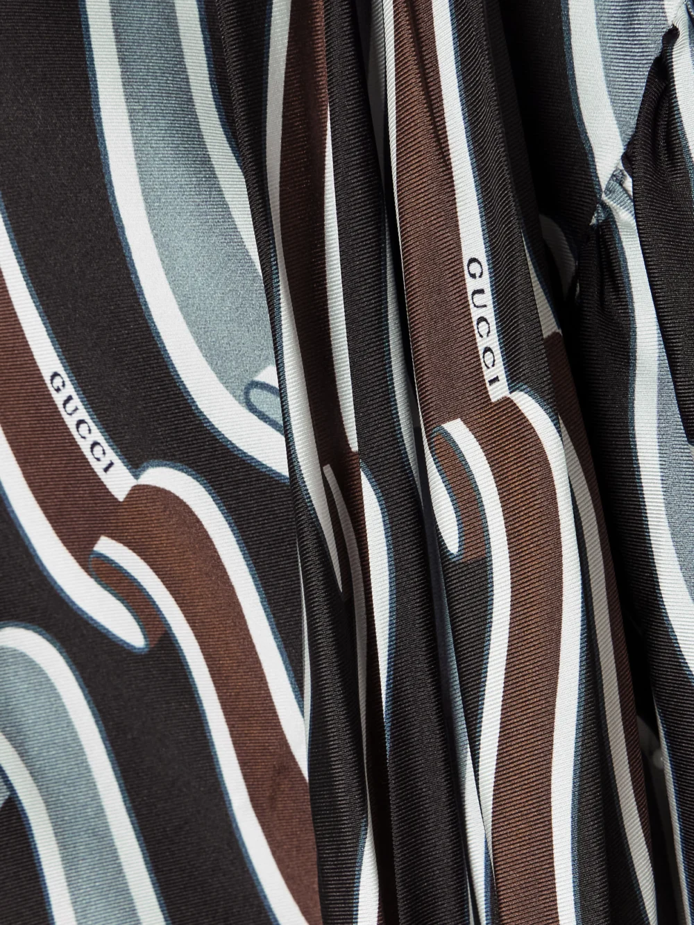 Close-up detail of the Gucci Tie-detailed Gathered Printed Silk-jacquard Blouse