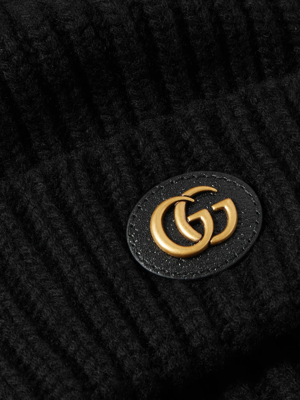 Close-up detail of the Gucci Victor Appliquéd Ribbed Wool and Cashmere-blend Beanie