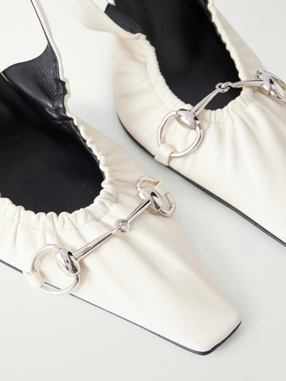 Close-up detail of the Gucci Vittoria 55 Horsebit-embellished Leather Slingback Pumps