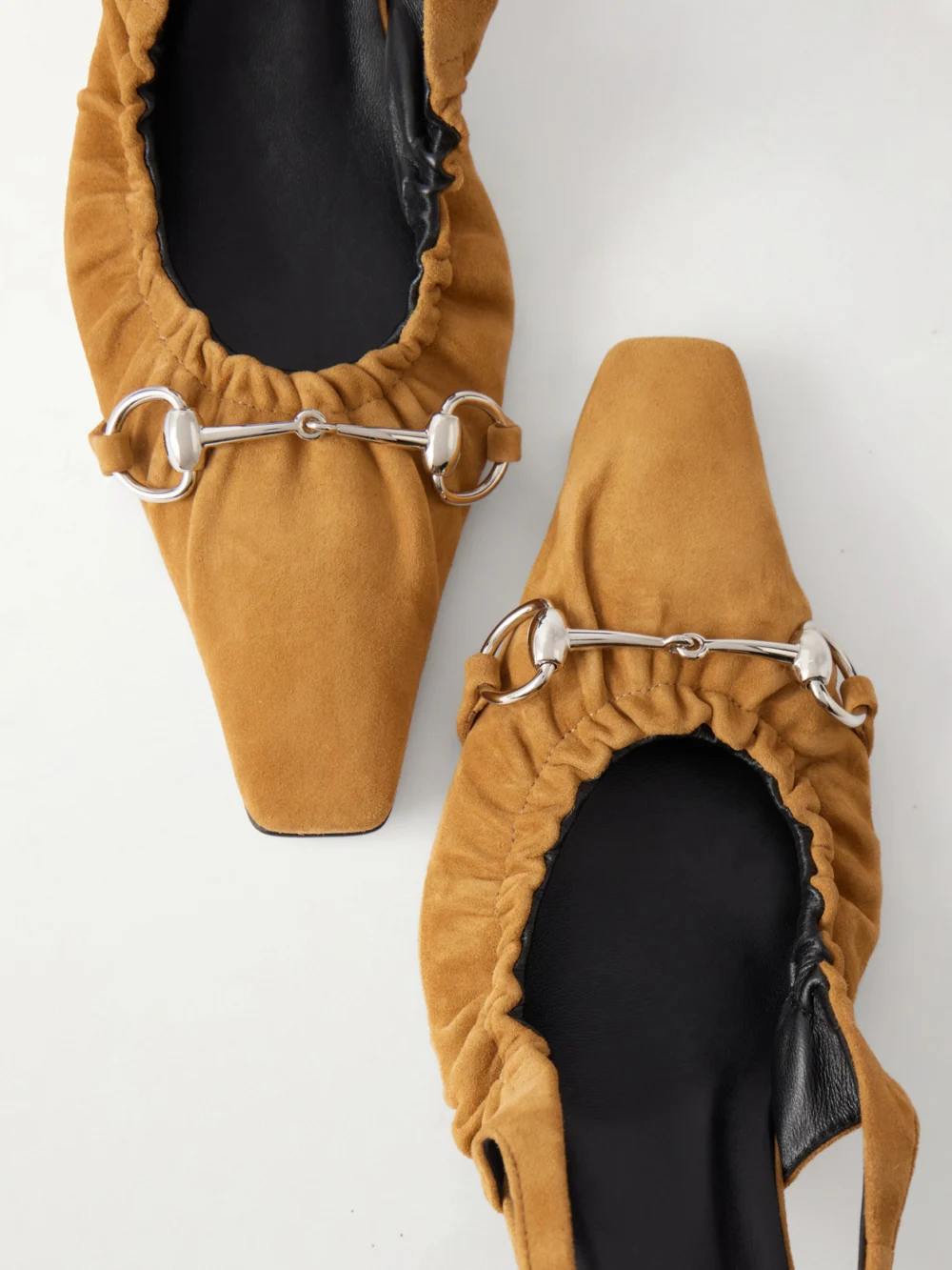 Close-up detail of the Gucci Vittoria 55 Horsebit-embellished Suede Slingback Pumps