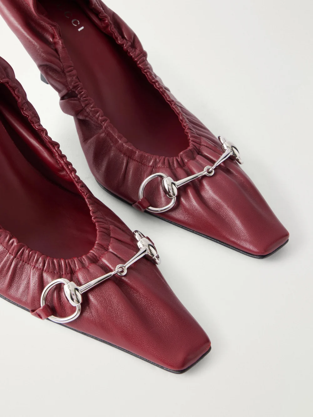 Close-up detail of the Gucci Vittoria 75 Horsebit-embellished Leather Pumps