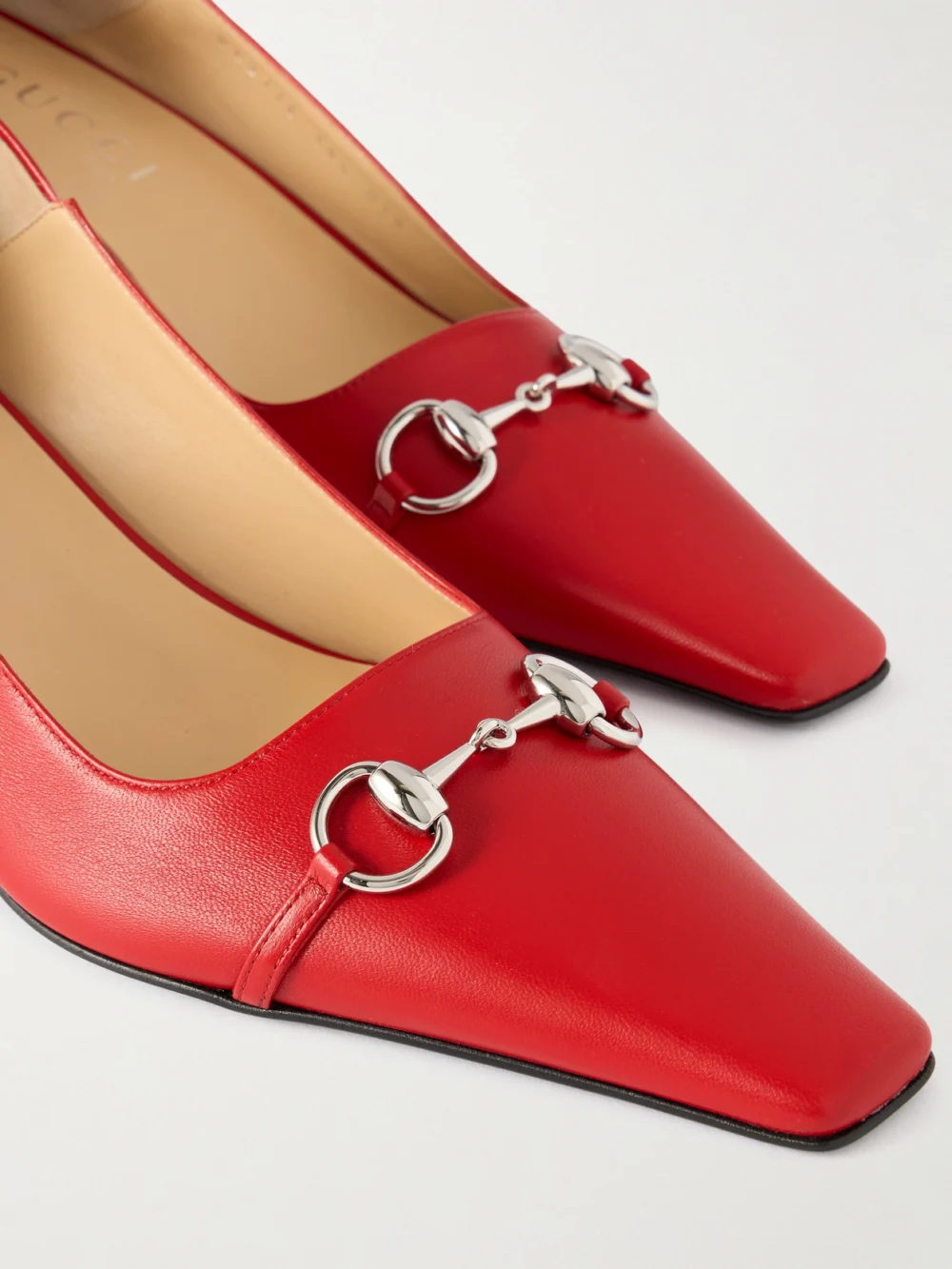 Close-up detail of the Gucci Vittoria Collapsible-heel Horsebit-embellished Leather Pumps